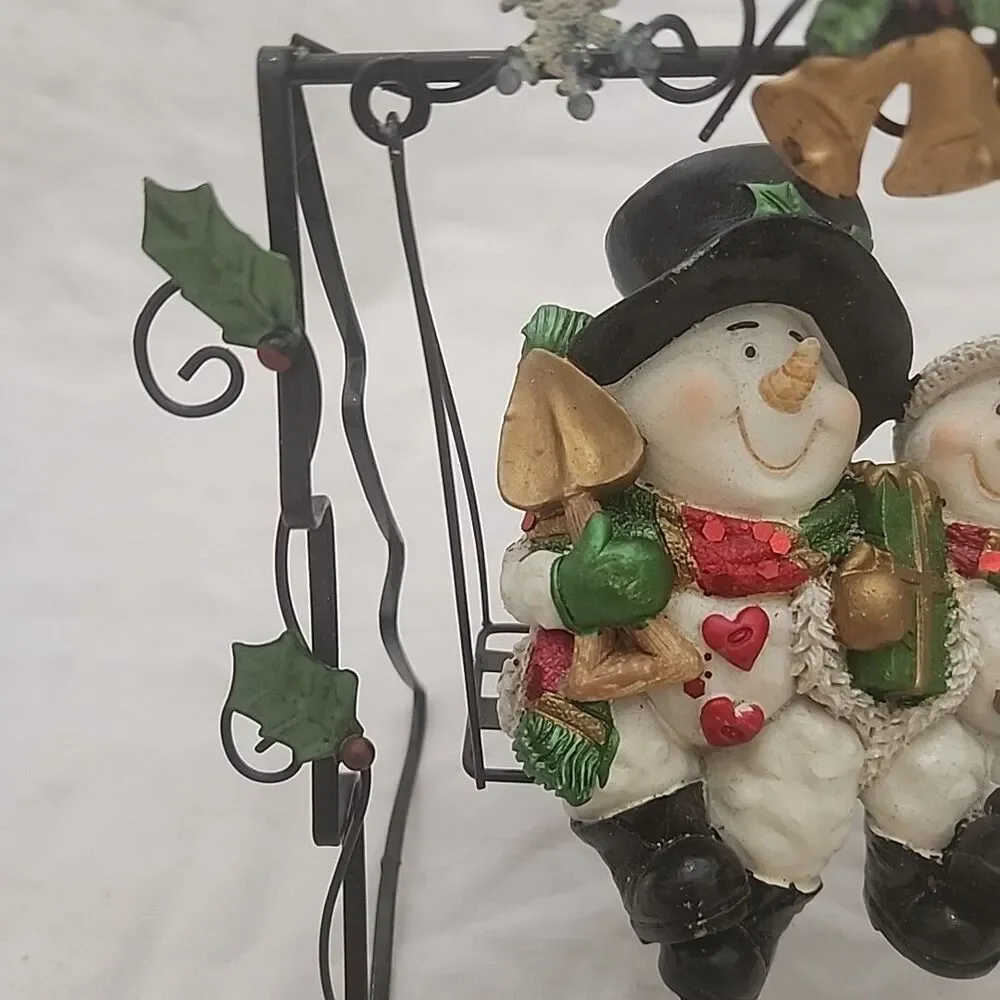 Swinging Snowman Couple Adorned With Glitter, Snowflakes, Bells, And Holly Berry